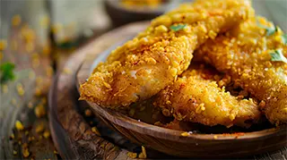photo of tasty crispy fried cajun catfish with garnish