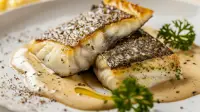 photo of french style broiled striped bass with creamy wine sauce