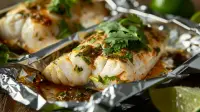 photo of mexican style sea bass in foil packets with green chiles and cilantro
