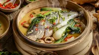 photo of a sea bass steamed with lemon grass and chili broth